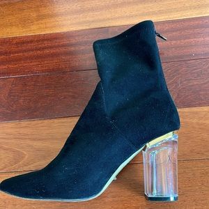 Black suede boots with clear plexi heels